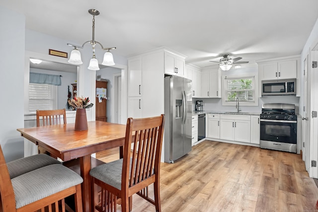 355 Farmington Ave, Bristol, CT 06010 - kitchen featuring appliances with stainless steel finishes, white cabinetry, and light wood-type flooring
