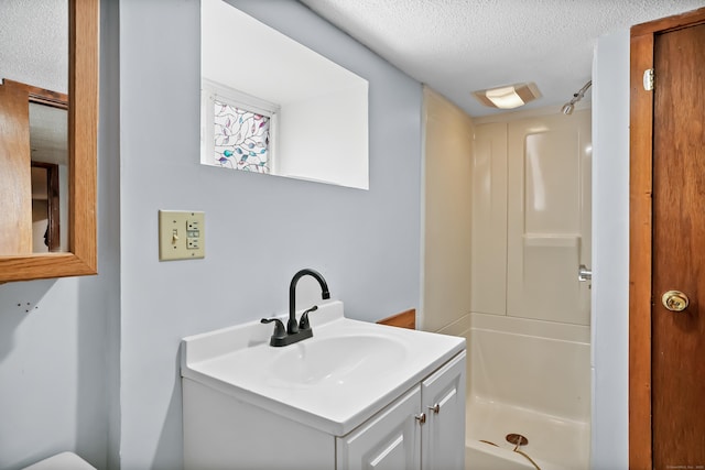 355 Farmington Ave, Bristol, CT 06010 - full bathroom featuring a shower, a textured ceiling, and vanity