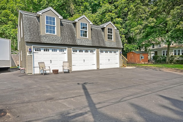 355 Farmington Ave, Bristol, CT 06010 - garage featuring a storage shed
