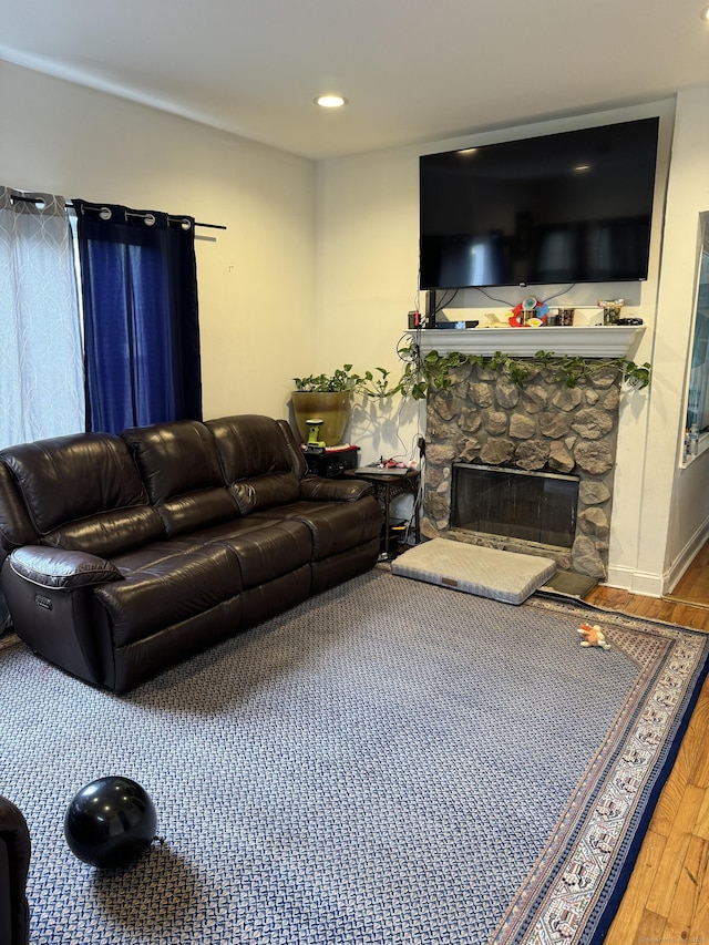 385 Chamberlain Ave, Bridgeport, CT 06606 - living area with wood finished floors, a stone fireplace, and recessed lighting