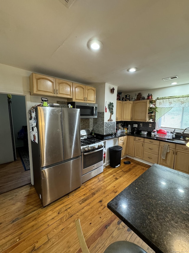 385 Chamberlain Ave, Bridgeport, CT 06606 - kitchen featuring appliances with stainless steel finishes, light brown cabinets, light wood-style flooring, and a sink