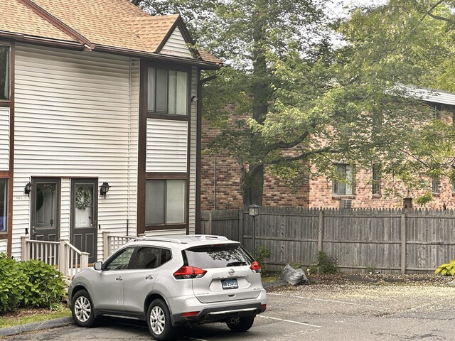 529 Woodward Ave Apt C, New Haven, CT 06512 - view of side of property with roof with shingles and uncovered parking