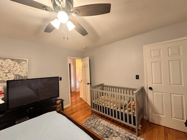 529 Woodward Ave Apt C, New Haven, CT 06512 - bedroom featuring wood finished floors, a ceiling fan, a textured ceiling, and baseboards