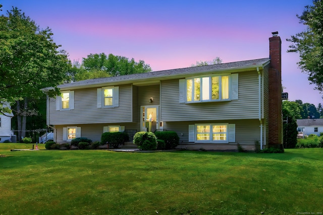 197 Hummingbird Dr, Berlin, CT 06037 - bi-level home featuring a chimney and a front lawn