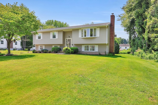 197 Hummingbird Dr, Berlin, CT 06037 - bi-level home with a chimney and a front lawn