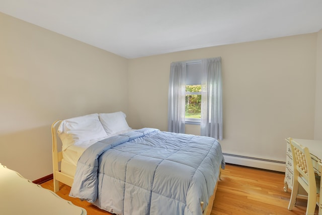 197 Hummingbird Dr, Berlin, CT 06037 - bedroom featuring baseboard heating and light wood-type flooring