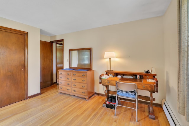 197 Hummingbird Dr, Berlin, CT 06037 - home office with a baseboard heating unit, light wood-type flooring, and baseboards