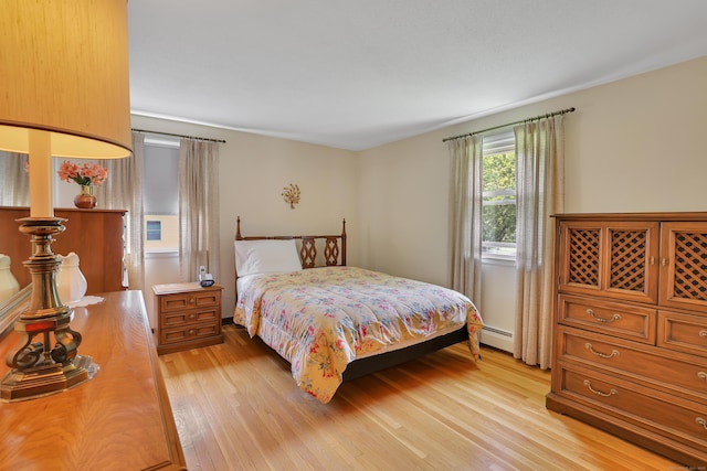 197 Hummingbird Dr, Berlin, CT 06037 - bedroom featuring a baseboard radiator and light wood-type flooring