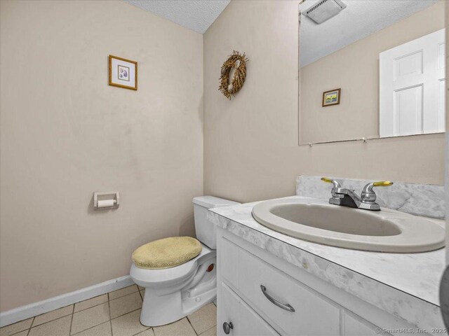 5 Marian Ln, Clinton, CT 06413 - half bathroom featuring toilet, vanity, a textured ceiling, tile patterned flooring, and baseboards