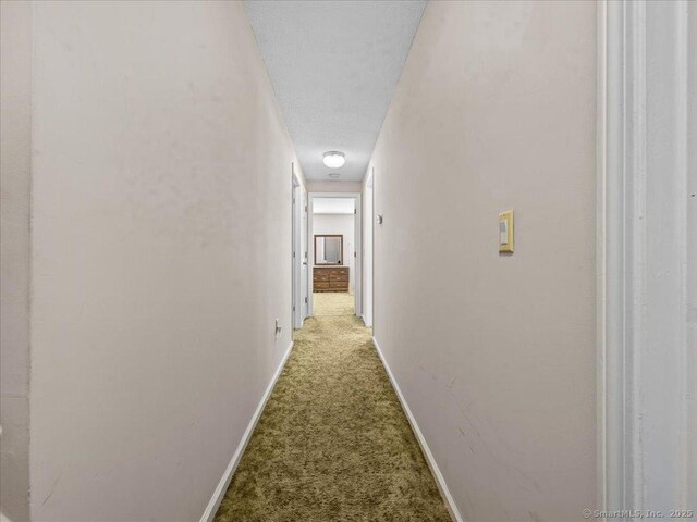 5 Marian Ln, Clinton, CT 06413 - hallway featuring carpet floors and baseboards