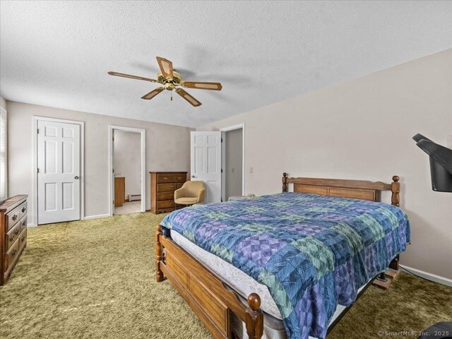 5 Marian Ln, Clinton, CT 06413 - bedroom featuring carpet floors, baseboard heating, baseboards, a textured ceiling, and a ceiling fan