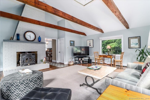 10 Hundred Acres Rd, Newtown, CT 06470 - living room featuring beamed ceiling, wood finished floors, a wood stove, baseboards, and high vaulted ceiling