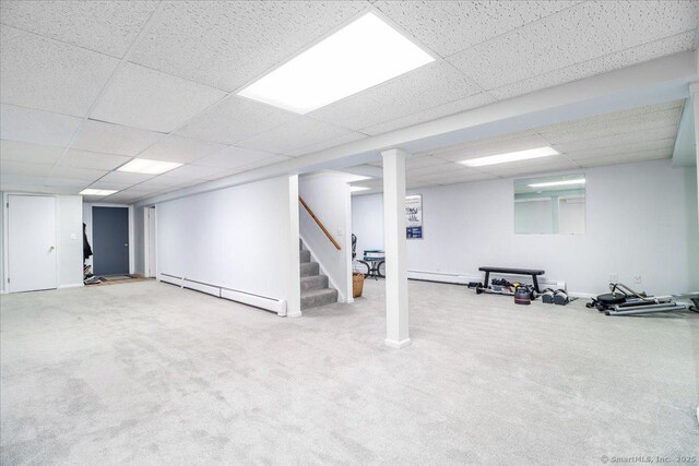 10 Hundred Acres Rd, Newtown, CT 06470 - finished basement featuring baseboard heating, stairway, a drop ceiling, and carpet flooring