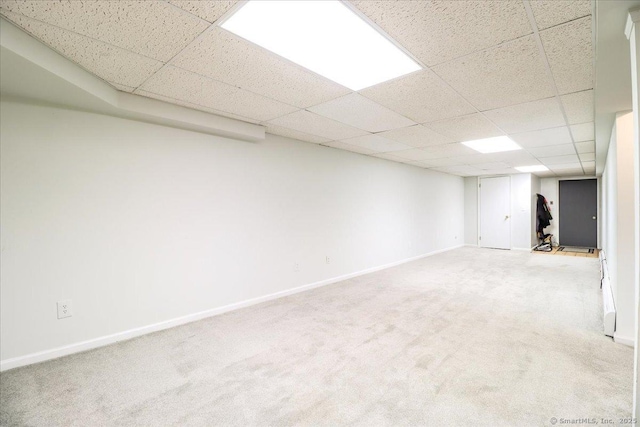 10 Hundred Acres Rd, Newtown, CT 06470 - finished basement featuring a paneled ceiling, carpet floors, and baseboards