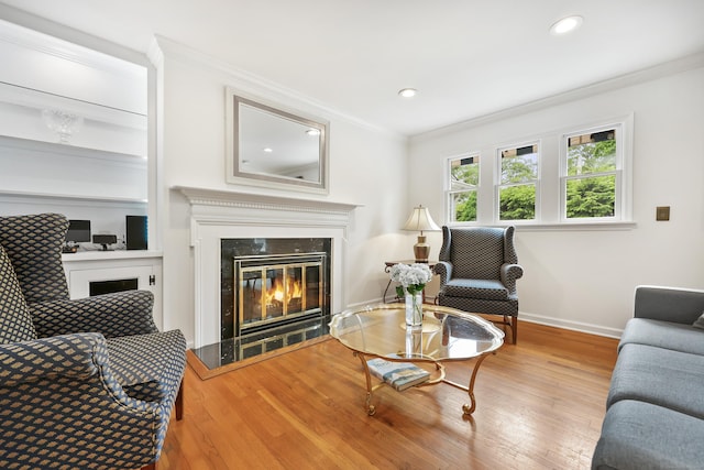 177 S Ave Unit 6, New Canaan, CT 06840 - living area with a glass covered fireplace, crown molding, wood finished floors, baseboards, and recessed lighting
