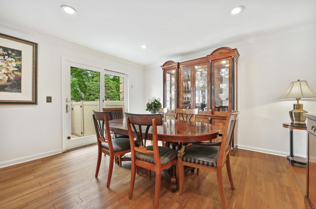 177 S Ave Unit 6, New Canaan, CT 06840 - dining space with light wood-style floors, baseboards, crown molding, and recessed lighting