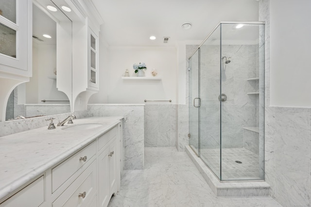 177 S Ave Unit 6, New Canaan, CT 06840 - bathroom featuring crown molding, a marble finish shower, vanity, tile walls, and recessed lighting