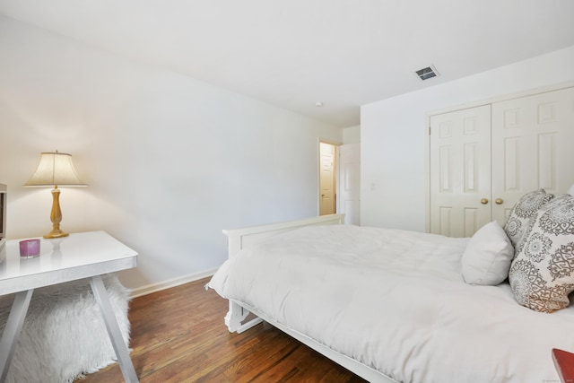 177 S Ave Unit 6, New Canaan, CT 06840 - bedroom with baseboards, dark wood-type flooring, and a closet