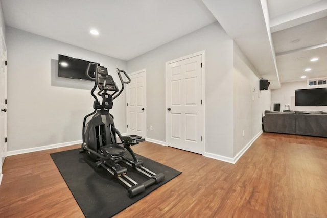 177 S Ave Unit 6, New Canaan, CT 06840 - workout room featuring wood finished floors, baseboards, and recessed lighting