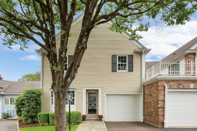 177 S Ave Unit 6, New Canaan, CT 06840 - view of front of house featuring a balcony, a garage, and driveway