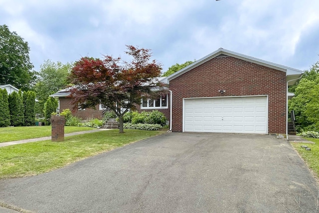 92 Milardo Ln, Middletown, CT 06457 - view of front facade with asphalt driveway, a front yard, brick siding, and an attached garage