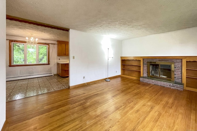 92 Milardo Ln, Middletown, CT 06457 - unfurnished living room featuring a baseboard heating unit, a textured ceiling, wood finished floors, a chandelier, and baseboards