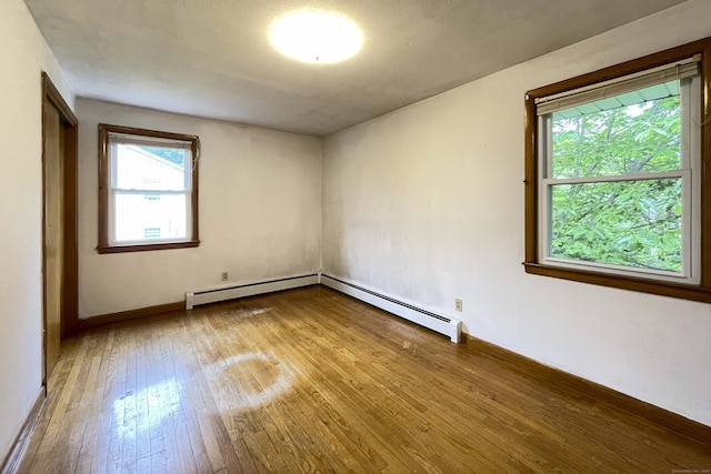 92 Milardo Ln, Middletown, CT 06457 - spare room featuring hardwood / wood-style floors, baseboards, and a baseboard radiator