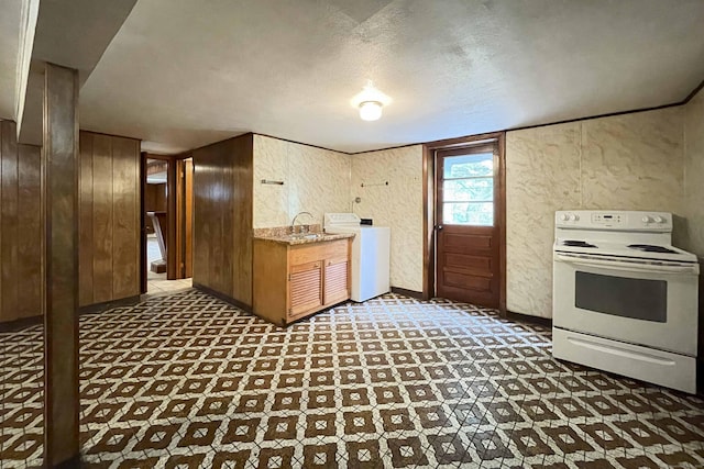 92 Milardo Ln, Middletown, CT 06457 - kitchen with washer / clothes dryer, white electric range oven, a textured wall, tile patterned floors, and a sink