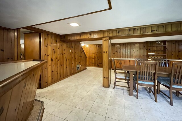 92 Milardo Ln, Middletown, CT 06457 - unfurnished dining area featuring wood walls and light tile patterned flooring