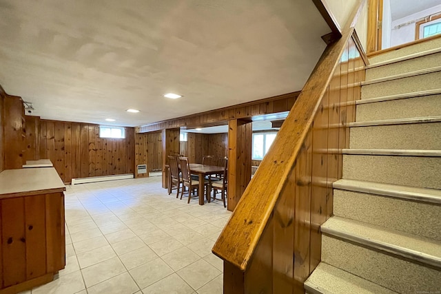 92 Milardo Ln, Middletown, CT 06457 - stairway with a baseboard heating unit, wood walls, and tile patterned floors