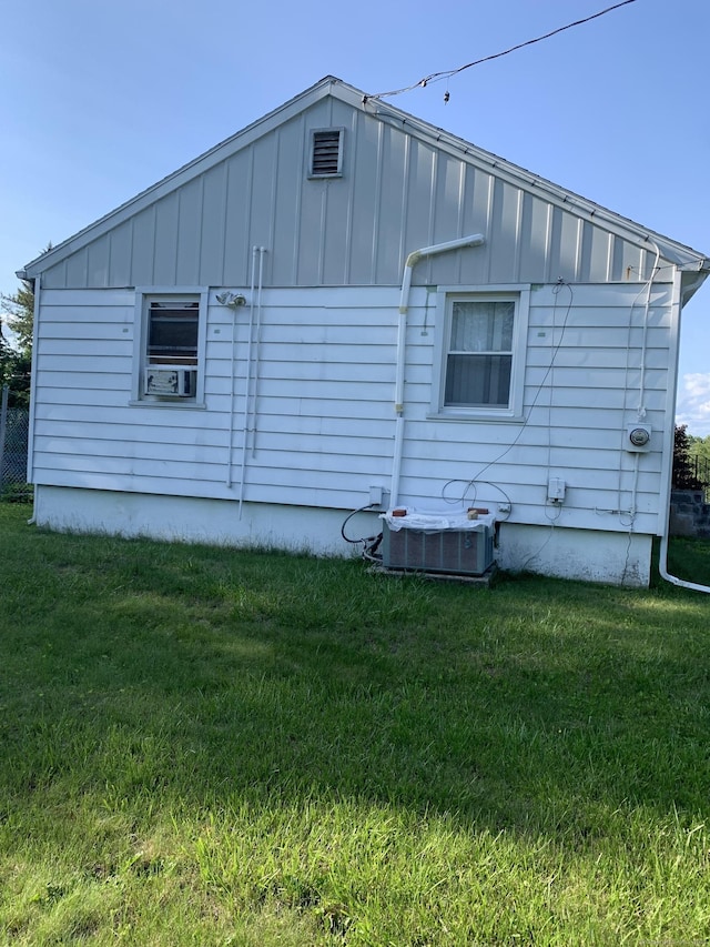 9 Hillcrest Ave, Ledyard, CT 06339 - view of property exterior featuring board and batten siding, cooling unit, and a lawn