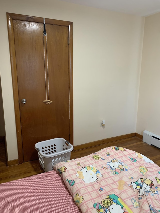 9 Hillcrest Ave, Ledyard, CT 06339 - bedroom featuring wood finished floors, baseboards, and a closet