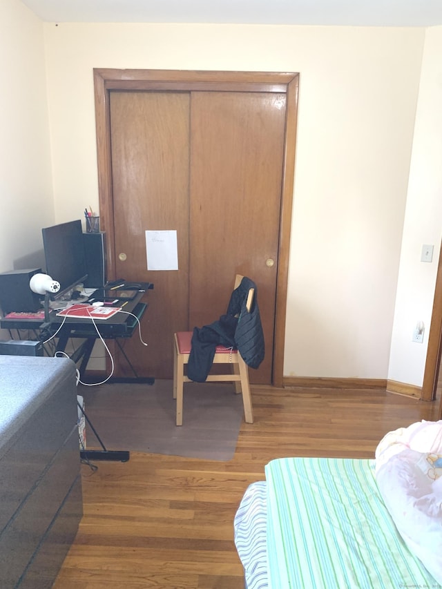 9 Hillcrest Ave, Ledyard, CT 06339 - bedroom with wood finished floors, a closet, baseboards, and an office area