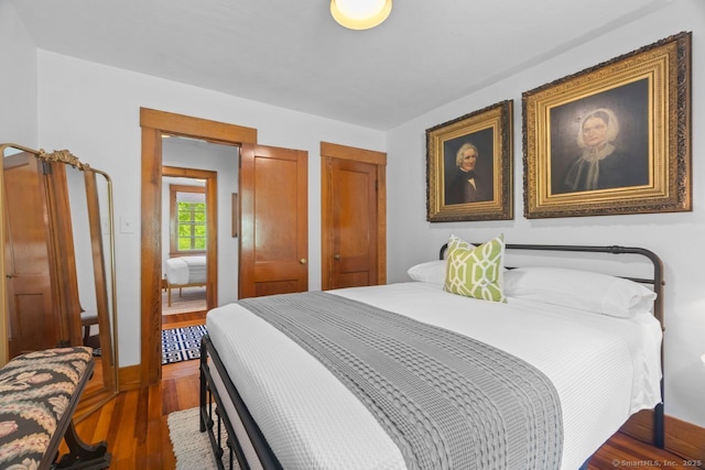 145 Main St, Essex, CT 06442 - bedroom with wood finished floors, multiple closets, and baseboards