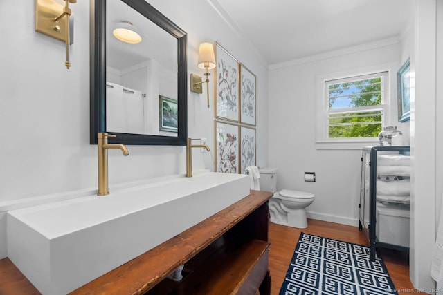 145 Main St, Essex, CT 06442 - bathroom featuring vanity, toilet, wood finished floors, and baseboards
