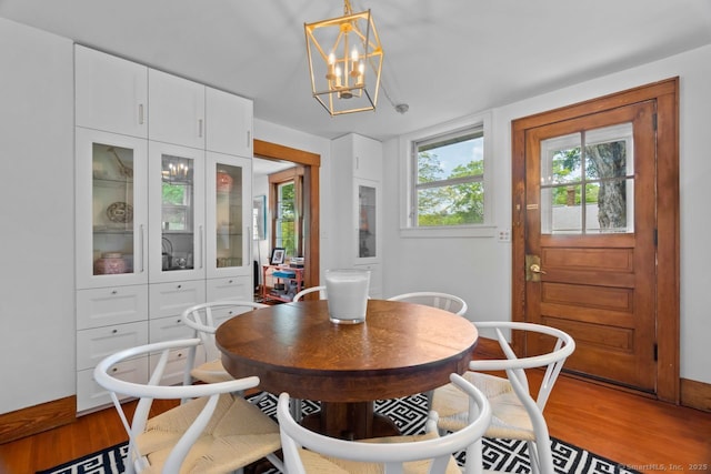 145 Main St, Essex, CT 06442 - dining space featuring light wood finished floors, a chandelier, and baseboards