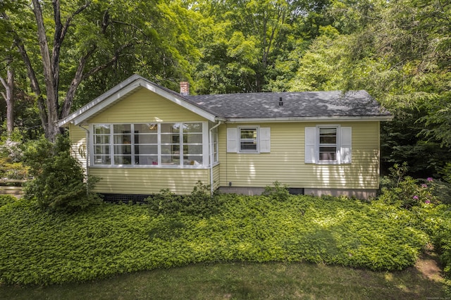 145 Main St, Essex, CT 06442 - view of front facade with a chimney and roof with shingles