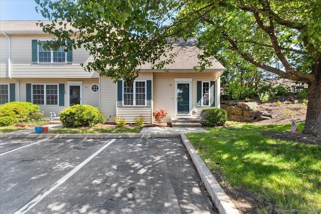 25 Briar Ln Unit 25, Norwich, CT 06360 - view of front of home with uncovered parking and a front lawn