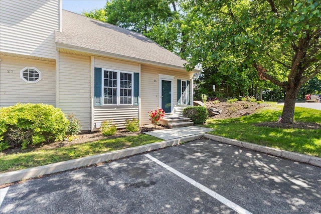 25 Briar Ln Unit 25, Norwich, CT 06360 - view of front of house with uncovered parking and roof with shingles