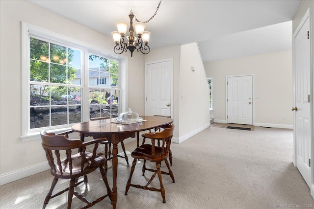 25 Briar Ln Unit 25, Norwich, CT 06360 - dining area featuring a chandelier, light carpet, and baseboards