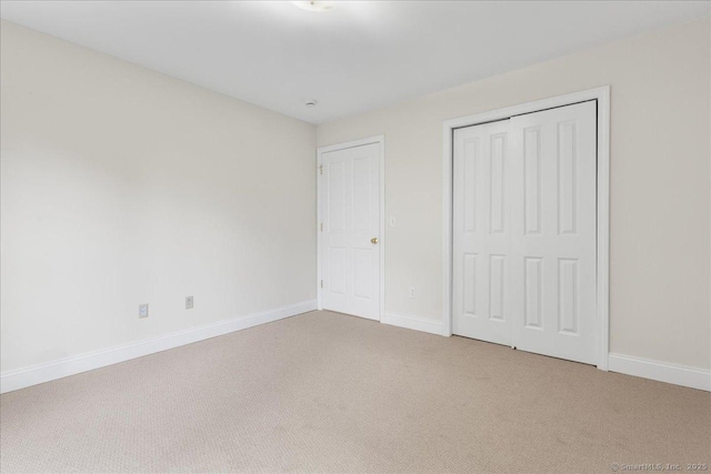 25 Briar Ln Unit 25, Norwich, CT 06360 - unfurnished bedroom featuring carpet floors, baseboards, and a closet
