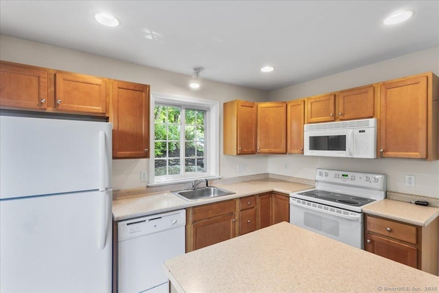 25 Briar Ln Unit 25, Norwich, CT 06360 - kitchen featuring white appliances, a sink, light countertops, recessed lighting, and brown cabinets