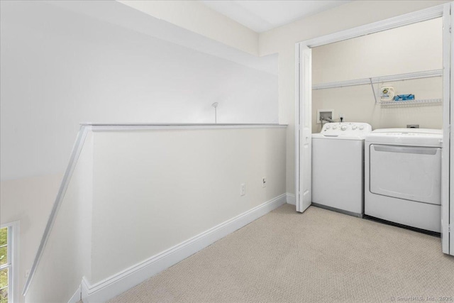 25 Briar Ln Unit 25, Norwich, CT 06360 - laundry room with washer and clothes dryer, light carpet, and baseboards