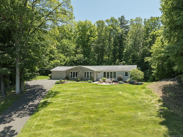 24 Sky Ridge Dr, Somers, CT 06071 - view of front of property with driveway, an attached garage, a front yard, and a view of trees
