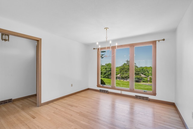 24 Sky Ridge Dr, Somers, CT 06071 - spare room featuring light wood finished floors, a chandelier, and baseboards