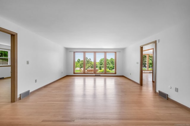24 Sky Ridge Dr, Somers, CT 06071 - unfurnished room with plenty of natural light, light wood-type flooring, and baseboards