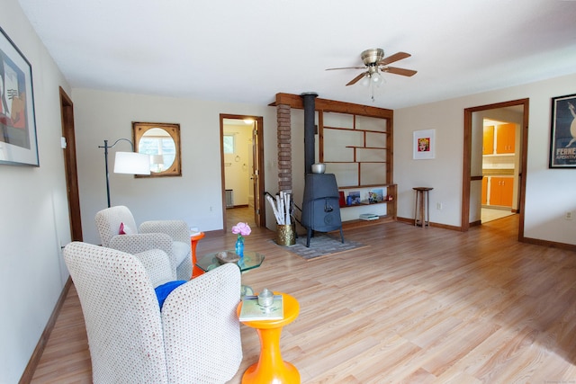 6 Cadwell St, West Hartford, CT 06107 - living room featuring ceiling fan, a wood stove, and wood finished floors