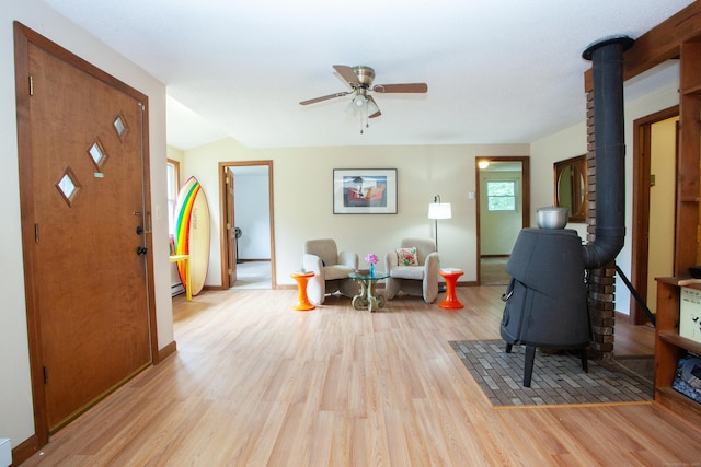 6 Cadwell St, West Hartford, CT 06107 - living room with a wood stove, light wood finished floors, and a ceiling fan