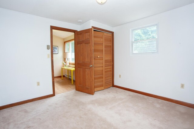 6 Cadwell St, West Hartford, CT 06107 - unfurnished room with light carpet, a baseboard heating unit, and a smoke detector