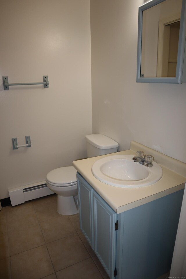 155 Jackson St, Ansonia, CT 06401 - half bath featuring a baseboard radiator, toilet, vanity, and tile patterned floors